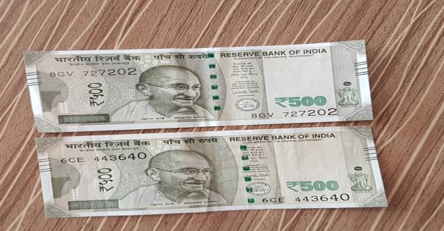 500 rupees fake note Mahatama Gandhi photo crossed wire