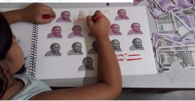 Fact Check: Is it true that a girl cutting picture of Gandhiji from Rs 500 and Rs 2000 notes?