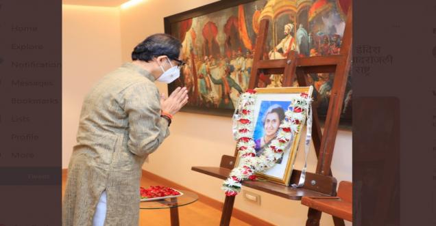 Uddhav Thackeray with folded hands in front of a portrait of late Prime Minister Indira Gandhi