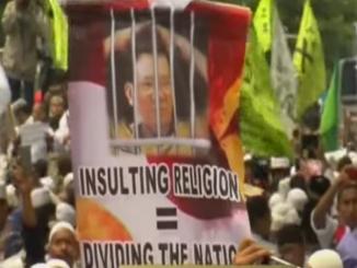 Jakarta muslims march against city governer who is Christian
